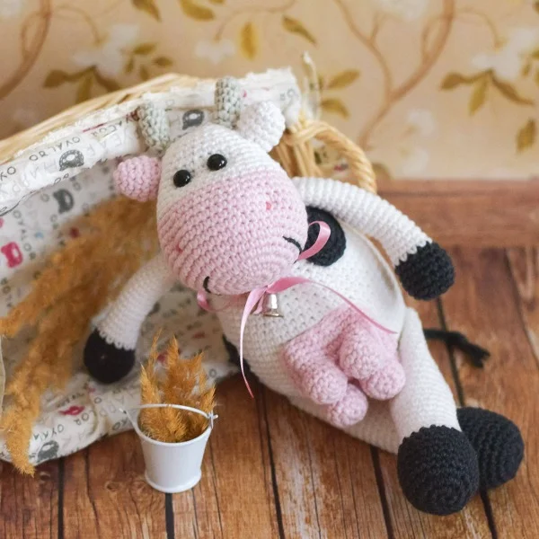 Crochet cow amigurumi toy.