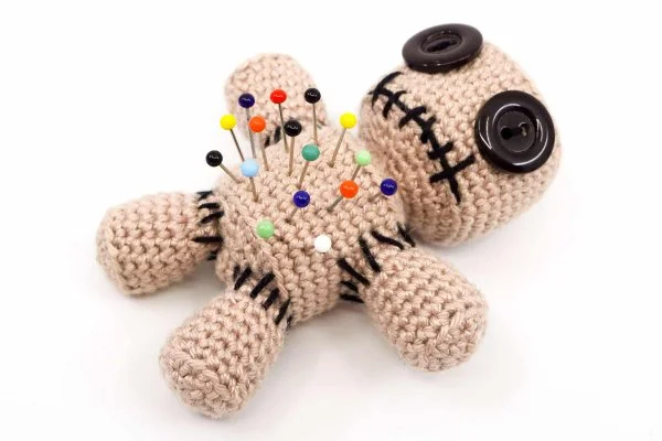 Crocheted voodoo doll pin cushion.