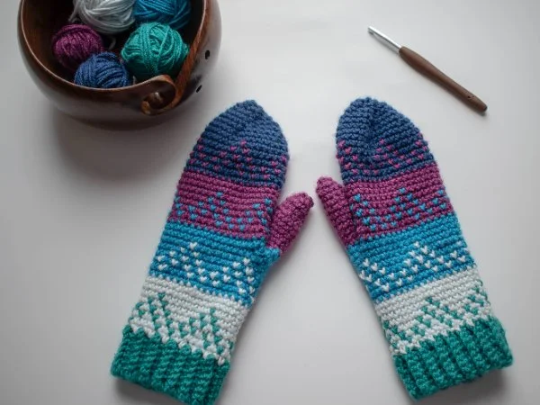 Colorful crocheted mittens with Fair Isle colorwork.