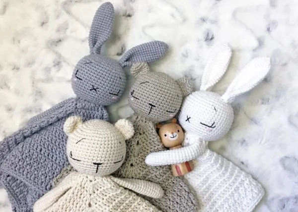 A group of crochet bear and bunny loveys.
