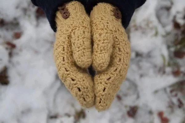 Yellow crochet mittens.