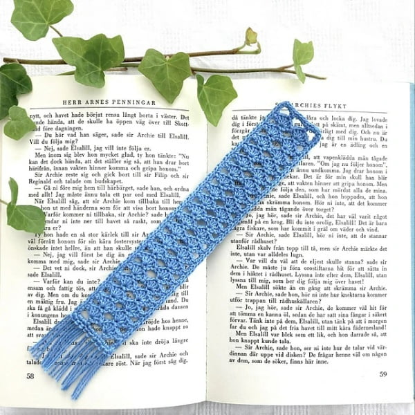 Blue fringed crochet bookmark.