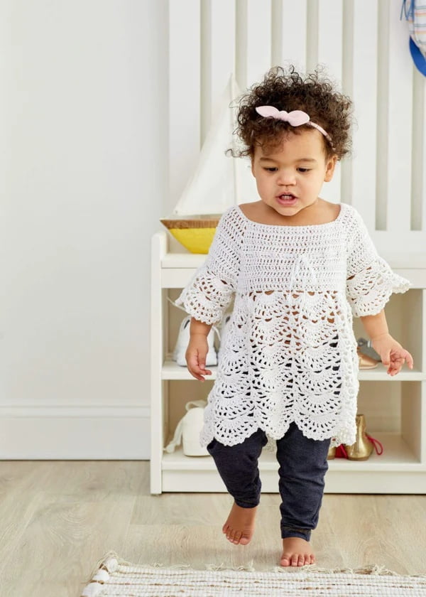 White, lacy, boho-style crochet toddler dress.