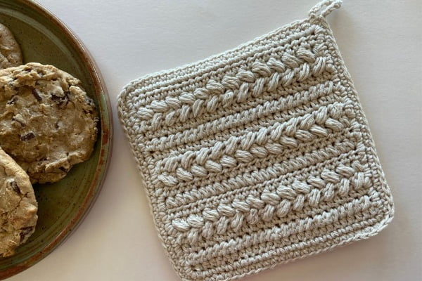Crochet potholder featuring puff stitch.