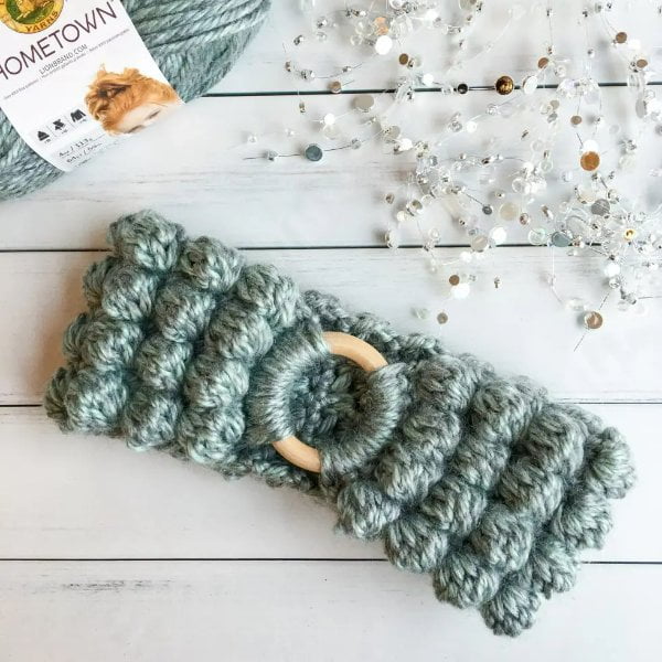 Blue green crochet bobble stitch headband.