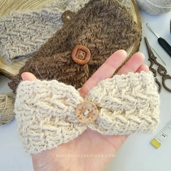 Three crocheted headbnads with button detail.
