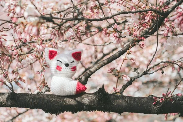 Crocheted Kitsune amigurumi.