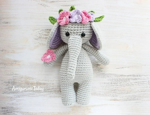 Amigurumi elephant with flower crown.