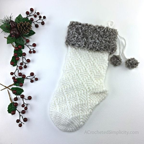 Crochet Christmas stocking with diamond pattern.