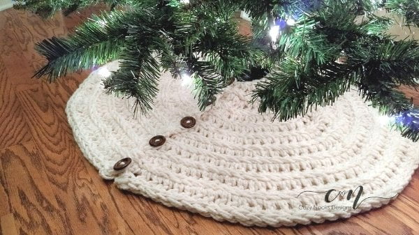 Chunky crochet Christmas tree skirt with wooden buttons.
