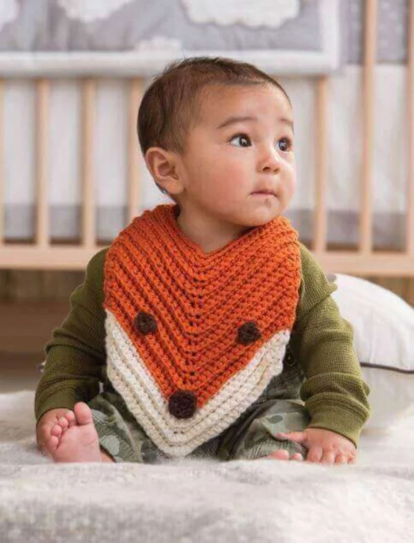 Crocheted fox baby bib.