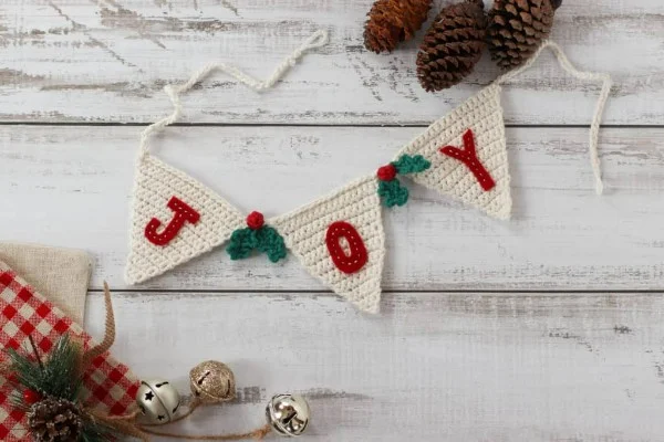 Joy and mistletoe crocheted garland.