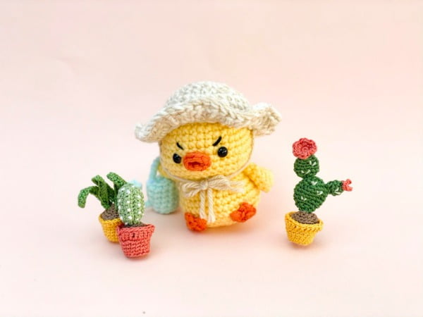 Crochet chick with a grumpy expression.