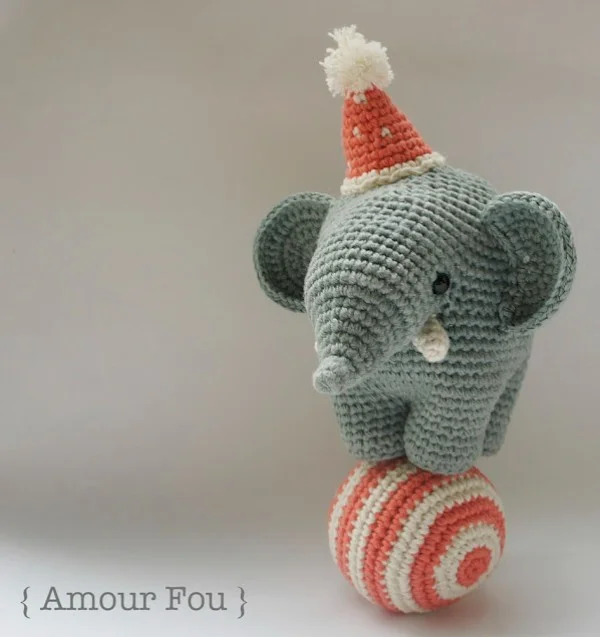 Crochet circus elephant balancing on a ball.