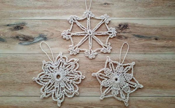 Three crochet snowflake ornaments.