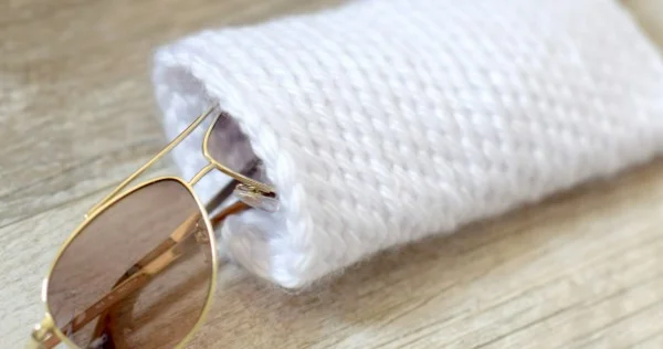 White crocheted sunglasses case.