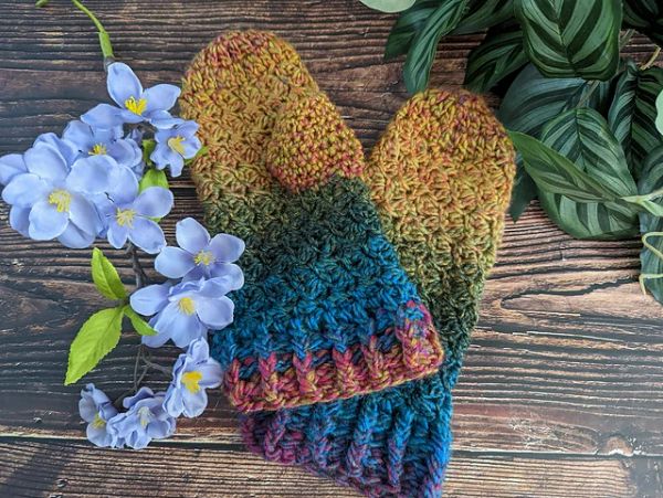 A pair of colorful crocheted mittens.