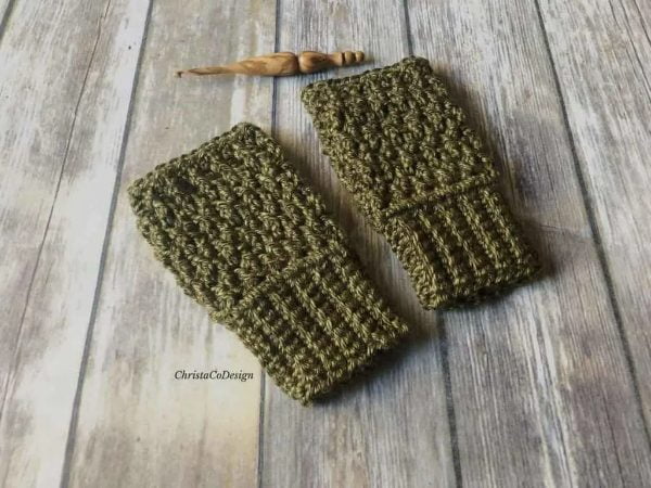 Khaki colored crochet fingerless gloves.