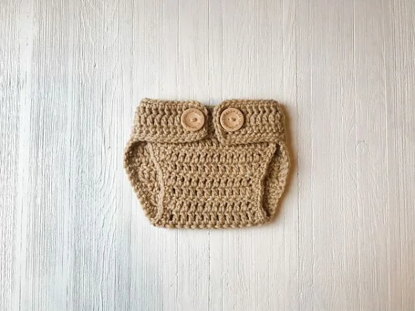 Brown crochet diaper cover with two buttons.