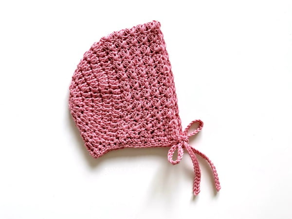 Rose pink crochet bonnet.