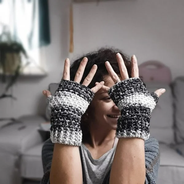 Salt and Pepper colored crochet fingerless gloves.