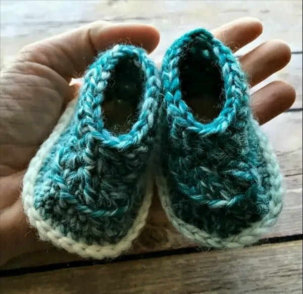 Crocheted baby booties made with Scarfie yarn.