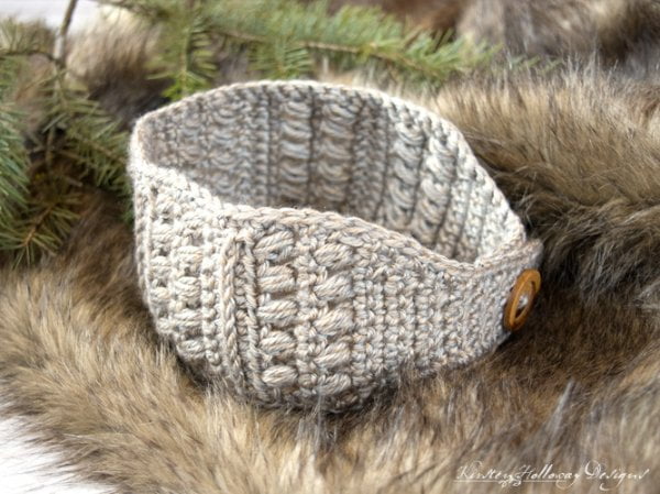 Crochet headband with button closure.