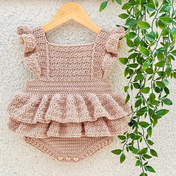 Frilly pink crochet baby romper.