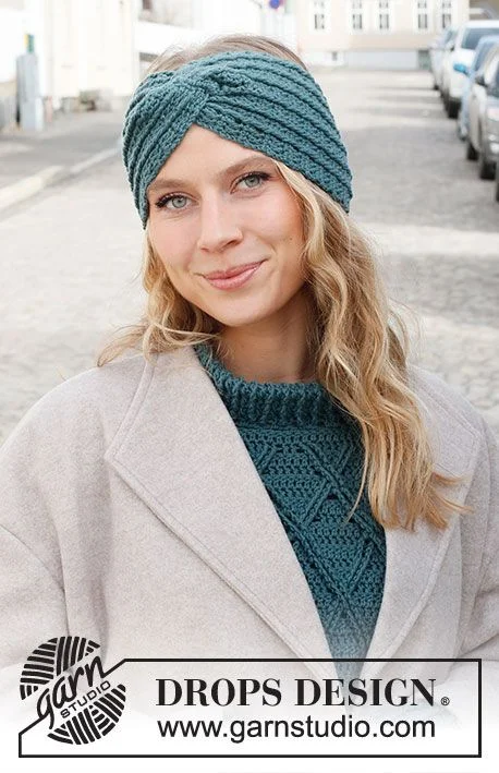 Teal colored crochet headband with twist feature.