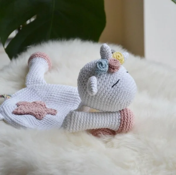 Crochet unicorn baby lovey comforter.