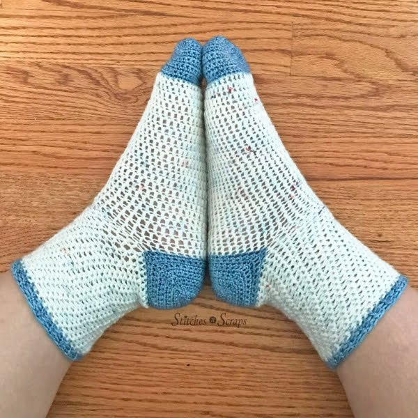 Crochet socks with contrasting color heel.