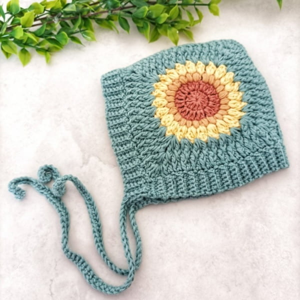 Sunflower free crochet baby bonnet pattern.