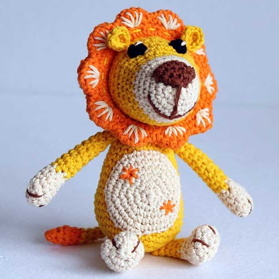 Brightly colored crochet lion