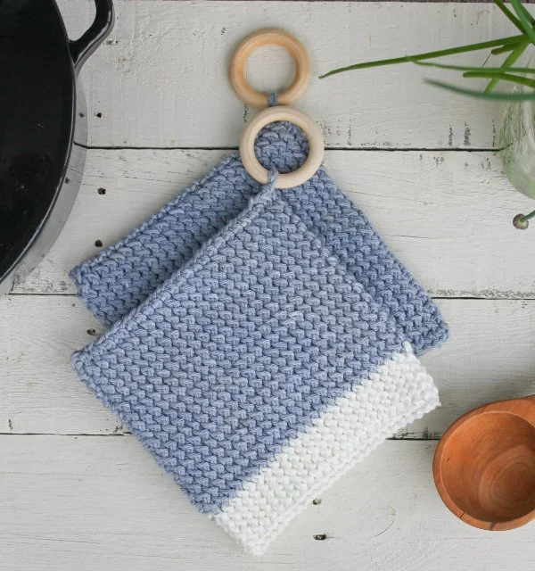blue and white crocheted potholders
