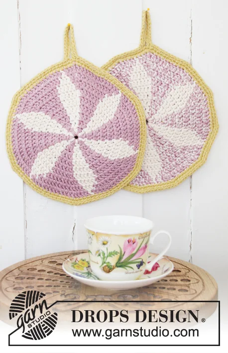 Round, pink crochet potholders.