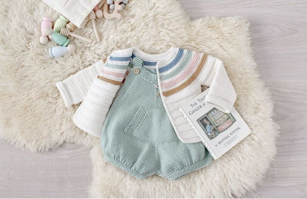 Crochet baby cardigan with pastel stripes.
