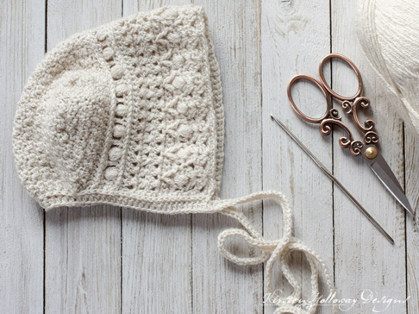 Classic crochet baby bonnet with beautfiul stitch detail.