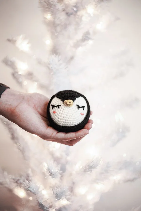 Crocheted penguin Christmas ornament.