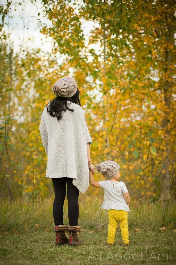 A woman and toddler wearing crochet beanies.