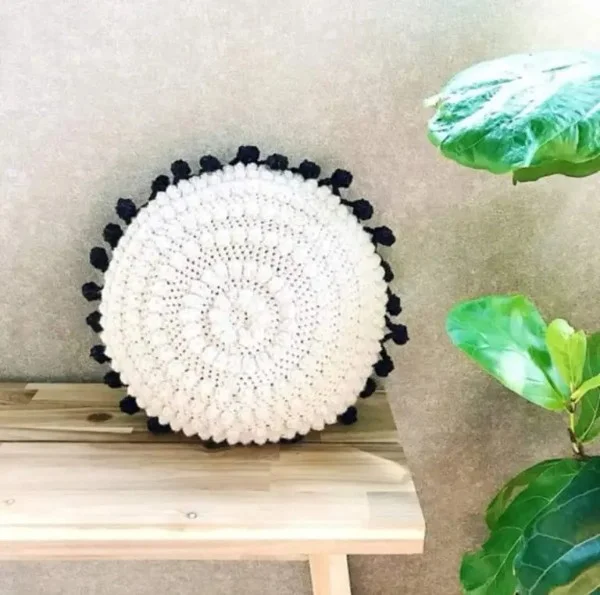 Black and white crochet pillow.
