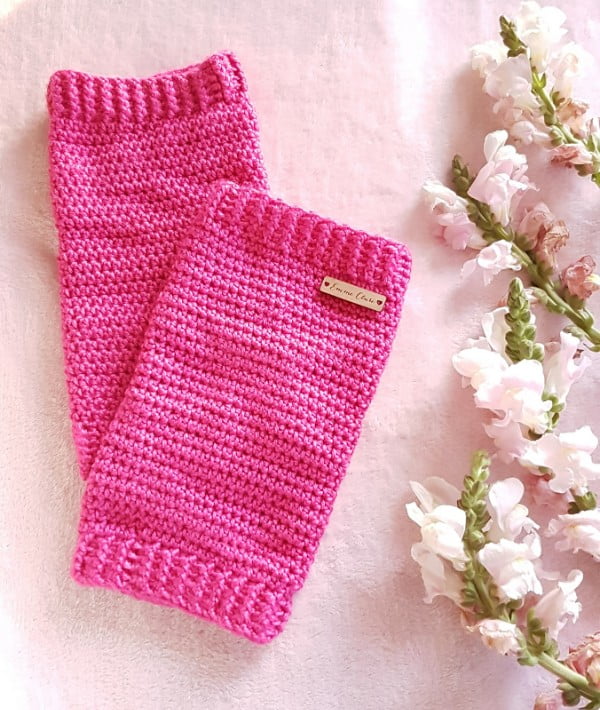 Bright pink crochet leg warmers.