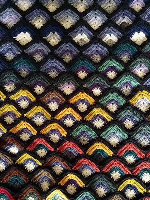 Mitred square crochet blanket.