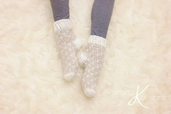 Beige and white crochet slipper socks.