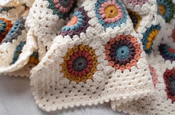 Multicolored crochet granny blanket.