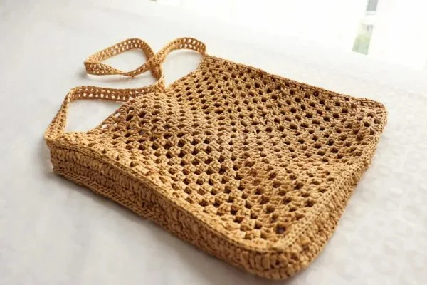 A crochet rafiia bag.