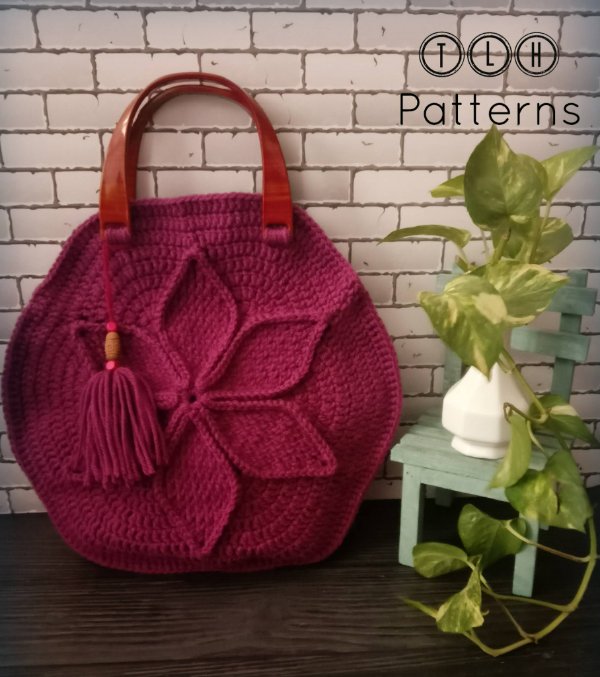 Red crochet bag with flower motif.