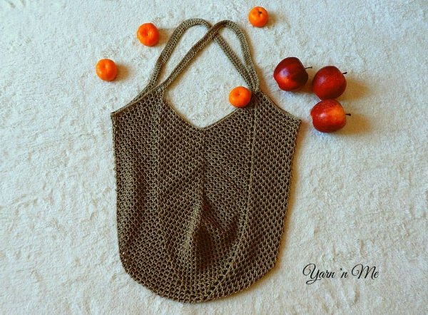 Brown mesh crochet market bag with fruit.