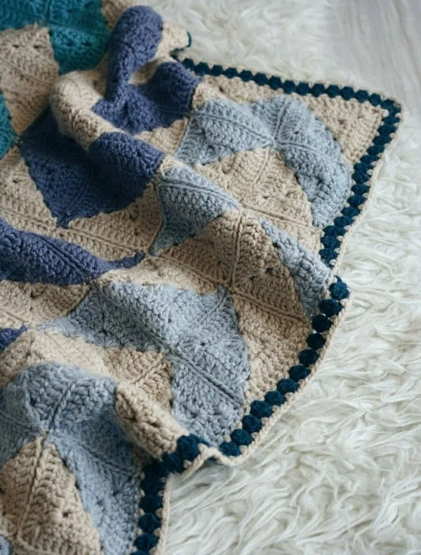 Quilt-inspired crochet baby blanket.