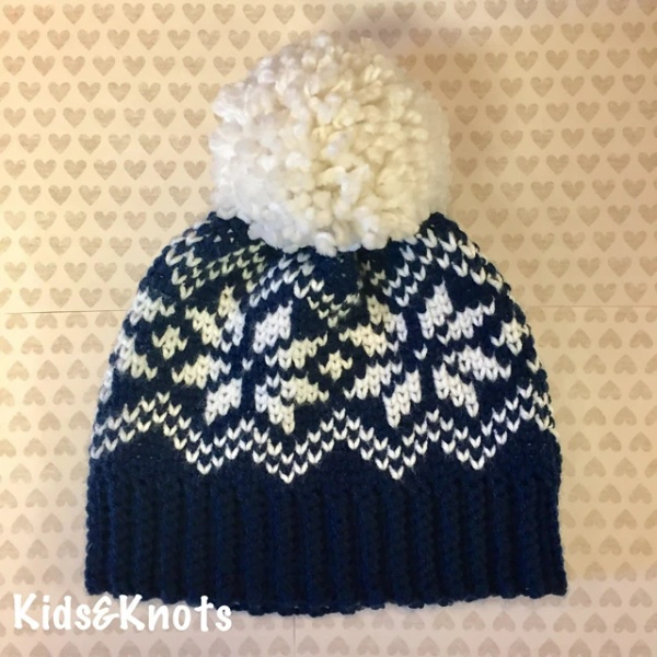 Crochet beanie with a snowflake motif.