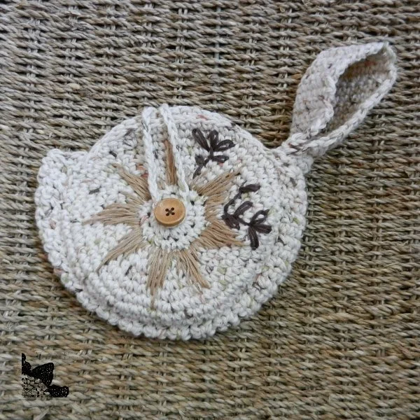 An embrodiered crochet circle bag.
